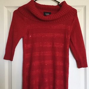 A long sleeve red dress for a kid.